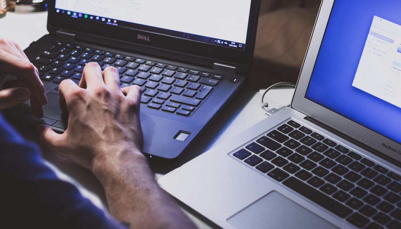 person using black laptop computer